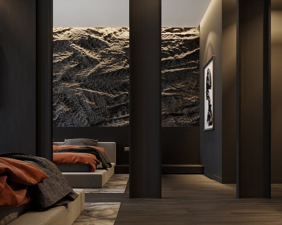 Sleek modern bedroom design with minimalist decor and warm tones.